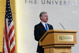FBI Director Christopher Wray delivers remarks at the FBI and University of Kansas Cybersecurity Conference on April 4, 2024, in Lawrence, Kansas.