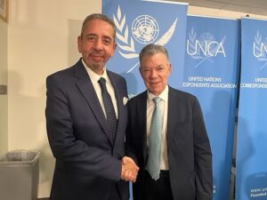 Ahmed Fathi with Juan Manuel Santos the Chair of the Elders and former President of Colombia, and Noble Peace Prize Laurette.